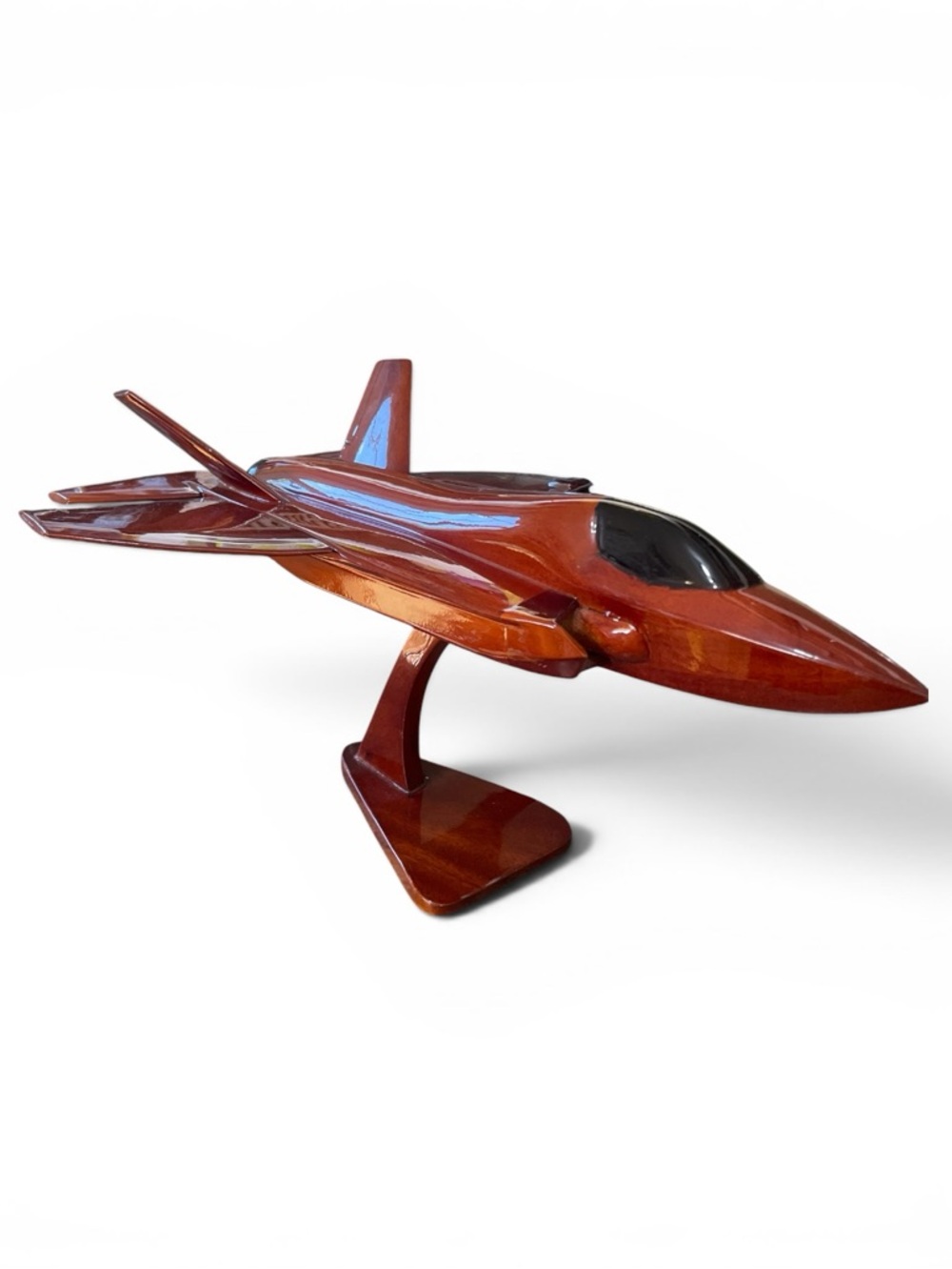 Mahogany wood model of a stealth fighter jet, handcrafted